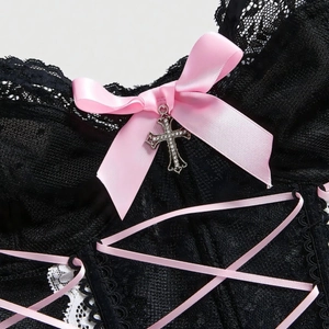 Black lace corset tank top with pink satin bows and a sparkling diamond cross pendant