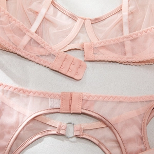 Detail view of the back closure and mesh texture on this pink sexy lingerie bodysuit set