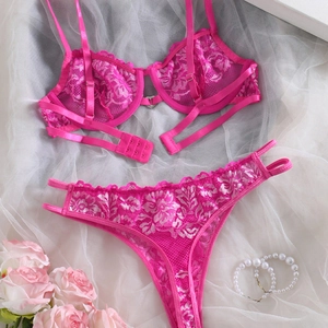 Hot pink lace lingerie set with heart buckle and floral embroidery on mesh background