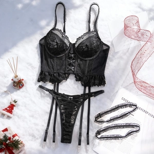 Lace corset lingerie set with stockings clips and festive holiday decor on white background