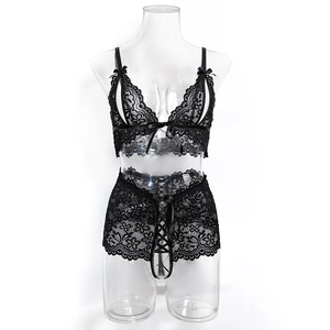 Detailed view of sheer black floral lace lingerie with corset style front lacing