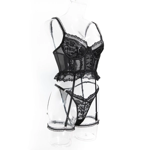 Detail view of black floral lace corset with underwire, garter belt and matching thong set
