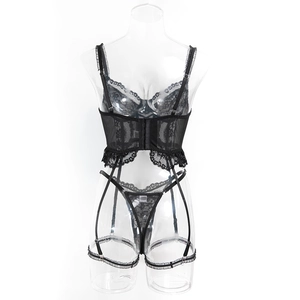 Detail view of black lace lingerie set with underwire bra and garter belt structure