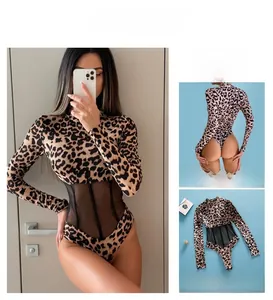 Detail of leopard print bodysuit with mesh paneling and sheer waist cut-outs
