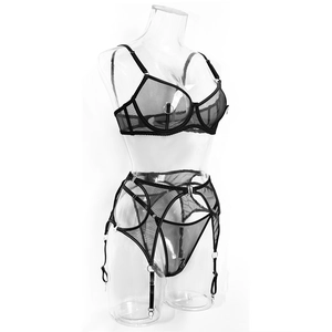 Detail of black mesh lingerie set with metal rings and adjustable strappy harness