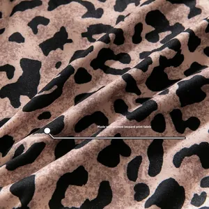 Detailed close-up of premium printed leopard pattern fabric with soft textured finish