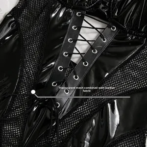 Macro detail of transparent mesh spliced with shiny black leather and cross straps