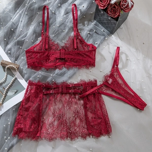 Detail of wine red eyelash lace lingerie set featuring bra, thong, and garter skirt