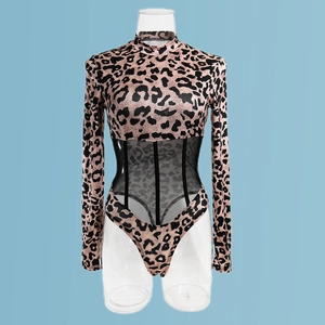 Detail of leopard print bodysuit featuring sheer mesh waist panels and slim fit design