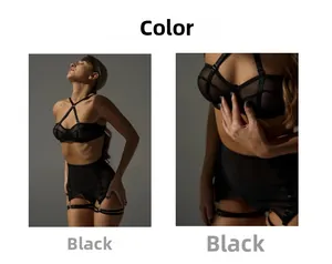 Detail of black sheer mesh bodysuit featuring cross halter neck and lace trim details