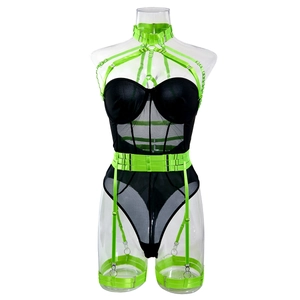 Detail of neon green straps on black mesh bodysuit with underwire cups and buckles