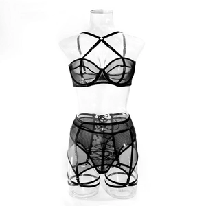 Detail of sheer black mesh bodysuit with criss-cross halter straps and intricate bondage lace-up back