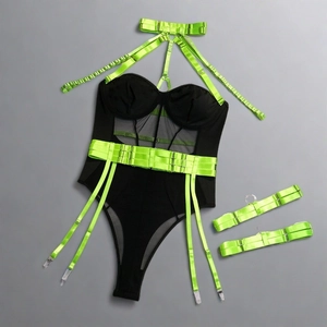 Detail of neon green straps and black mesh bodysuit with garters and bow collar