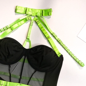 Detailed view of neon green adjustable straps and black mesh mesh on sexy bodysuit