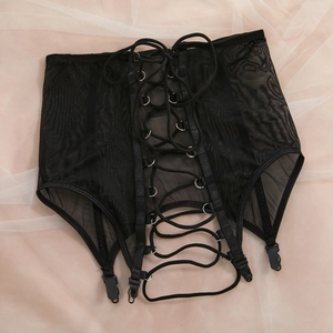 Close-up of black mesh garter belt with adjustable lace-up front and metal ring details