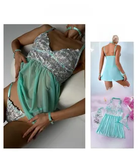 Detail of mint green lace embroidery and sheer mesh on sexy three-piece lingerie set