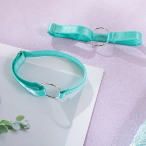 Detail of adjustable mint green elastic straps with silver metal rings and buckles