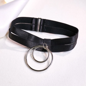 Detail of black elastic choker with interlocking silver metal rings and adjustable buckle