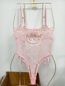 Detailed embroidery on pink floral lace bodysuit with mesh and side ribbon lacing