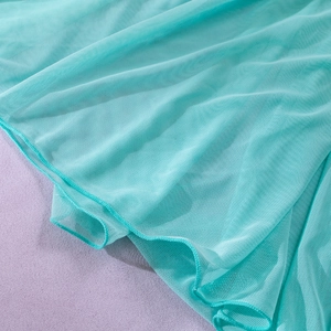 Close-up of mint green sheer mesh fabric with delicate hem stitching and soft folds
