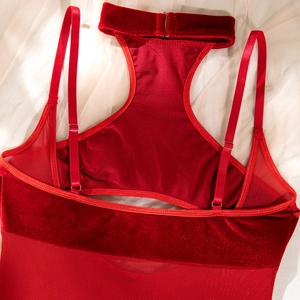 Detailed back view of red velvet and mesh halter bodysuit with open back and metal collar
