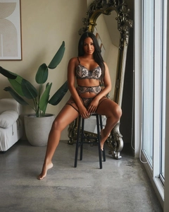 Detailed view of 3-piece lace lingerie set with black floral embroidery on beige base