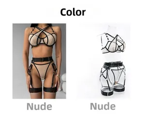 Detail view of a nude mesh lingerie set with black cross-straps and metal rings