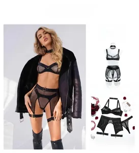 Detail view of black mesh bodysuit set with garter straps and metallic ring accents