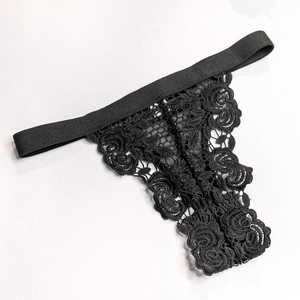 Close-up of black floral lace thong featuring rose embroidery and wide elastic waistband