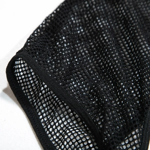 Detail of breathable black honeycomb mesh fabric with premium stitched reinforced edges
