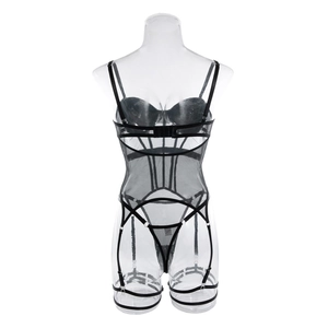 Detail of sheer black mesh bodysuit featuring adjustable garter straps and ribbed panels