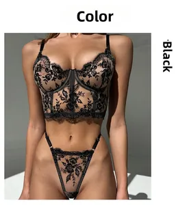 Detail of black floral lace embroidery and sheer mesh on a sexy underwire bra set