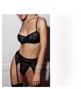 Three-piece black leopard mesh lingerie set with underwire bra and garter belt detail