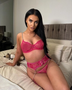 Detailed embroidery and metal chains on a sexy pink lace lingerie set for women