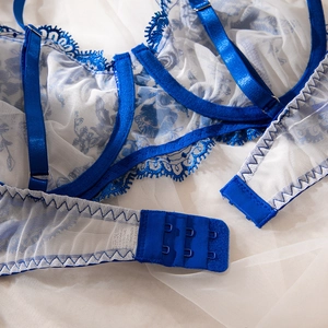 Detail of adjustable straps and back hook-and-eye closure on blue lace bodysuit