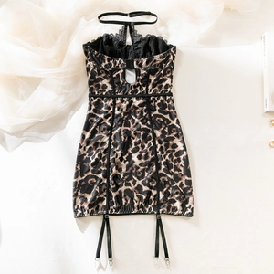 Detailed view of leopard print lingerie with black lace trim and garters on white background