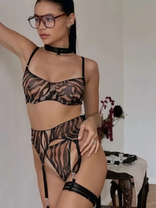 Detail view of sheer zebra print lingerie set with mesh fabric and metal ring accents