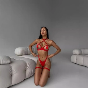 Three-piece red lingerie set featuring a halter tassel bra, thong, and leg rings for women