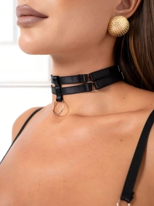 Detail of black double-layered choker with metal ring and gold textured button earrings