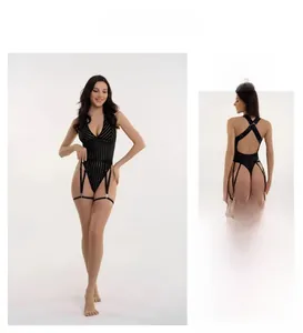 Macro shot of back view and lace-up garter straps of this striped black mesh bodysuit
