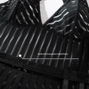 Detail of sexy black bodysuit showing special transparent striped fabric and texture