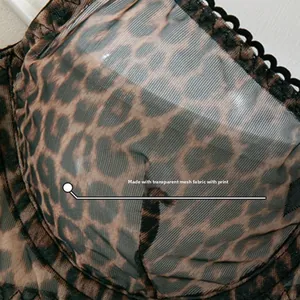 Detail shot of leopard print sheer mesh fabric and scalloped lace trim on the bra cups