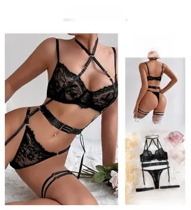 Detailed view of floral eyelash lace and criss-cross straps on black lingerie set