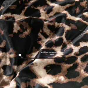 Close-up of leopard print fabric with smooth silky texture and elastic qualities