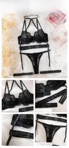 Detailed view of the sheer floral lace cups and harness-style straps on black lingerie
