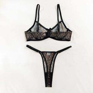 Detailed flat lay of leopard print sheer mesh lingerie set with scalloped lace edges