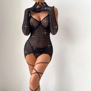 Detail of sheer mesh lingerie with sparkling rhinestones, leg straps and long gloves
