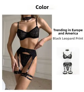 Detail of black leopard print lingerie set with lace bra, garter belt and choker