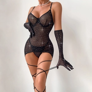 Close-up of black sheer mesh bodysuit with silver glitter, matching gloves and leg wraps