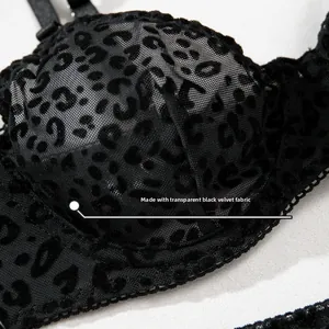 Detail of transparent black flocking fabric with leopard print on sexy lingerie set